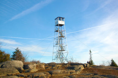 Low angle view of communications tower against sky