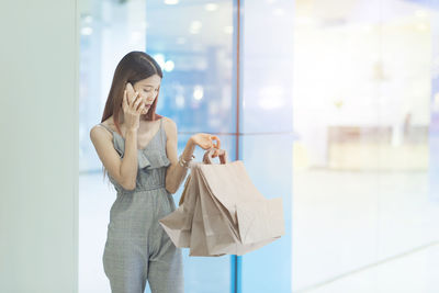 Young woman using mobile phone