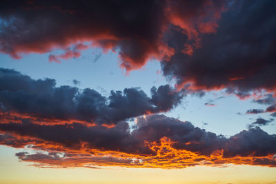 Low angle view of dramatic sky during sunset