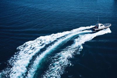 High angle view of boat in calm blue sea