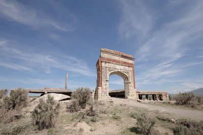 Arch bridge against sky