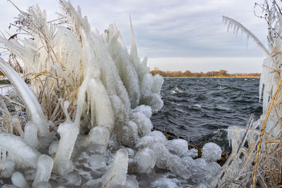 Icy bank of a lake due to the spray of freezing cold water