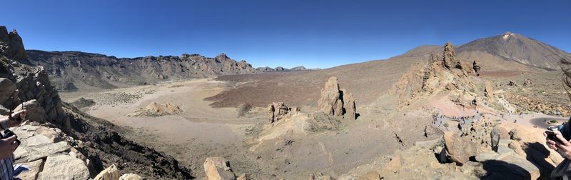 Scenic view of mountains against clear blue sky