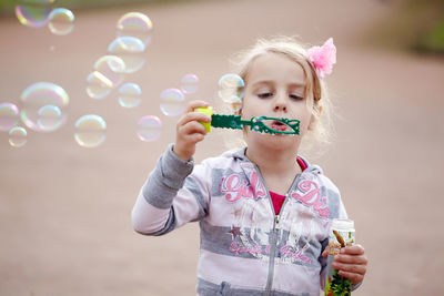 Full length of a beautiful young woman drinking bubbles