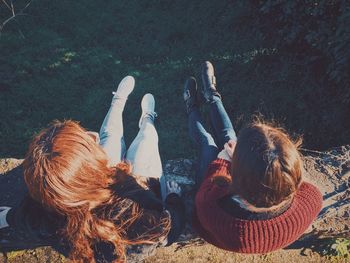 High angle view of people relaxing on field