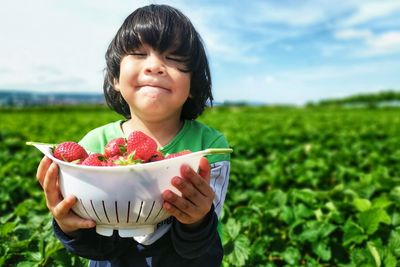 Girl holding ice cream in bowl