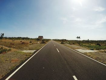 Empty road along landscape