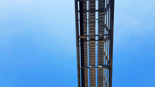 Low angle view of building against blue sky