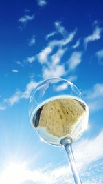 Low angle view of wine against blue sky