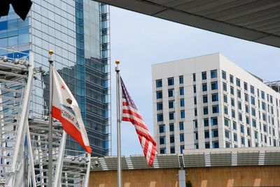 Low angle view of american flag against building