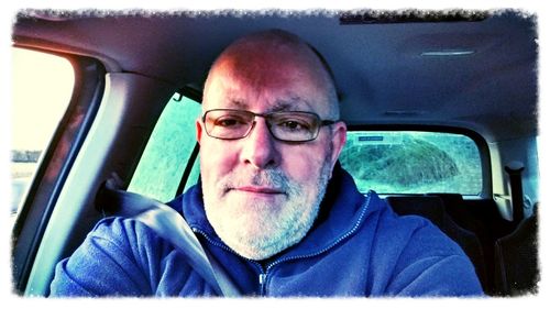 Portrait of man in car
