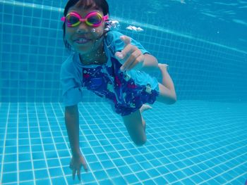 Woman swimming in pool