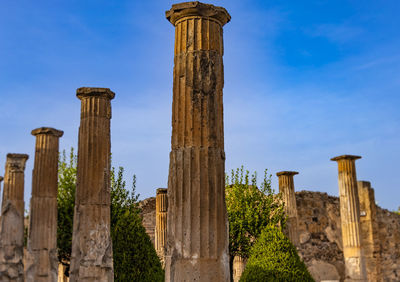 Low angle view of old ruins against sky