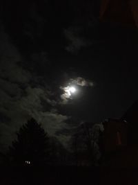 Low angle view of moon in sky at night