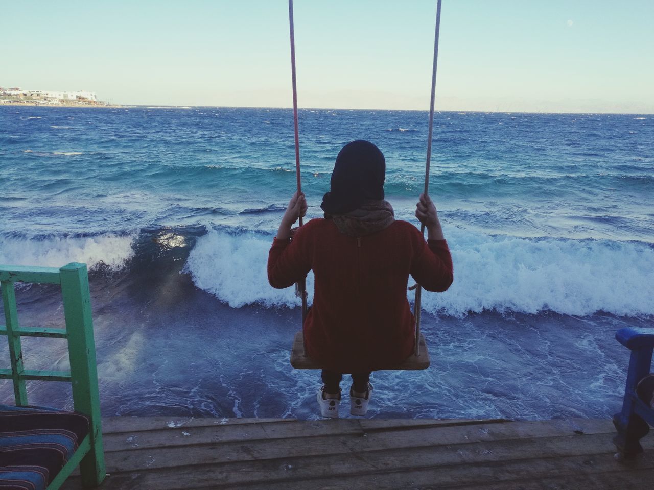 sea, rear view, water, real people, one person, standing, horizon over water, nature, leisure activity, outdoors, men, beauty in nature, day, wave, lifestyles, full length, childhood, beach, sky, fishing pole, people