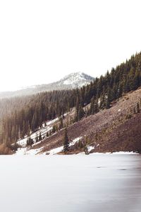 Scenic view of snow covered mountains against sky