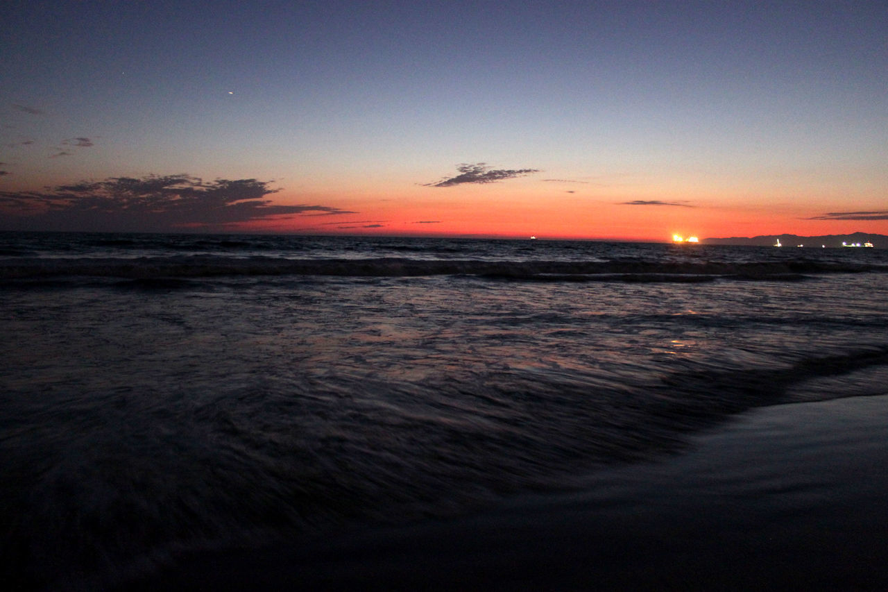 sunset, sea, water, horizon over water, scenics, tranquil scene, beauty in nature, orange color, beach, tranquility, sky, wave, idyllic, nature, shore, waterfront, seascape, reflection, dusk, outdoors