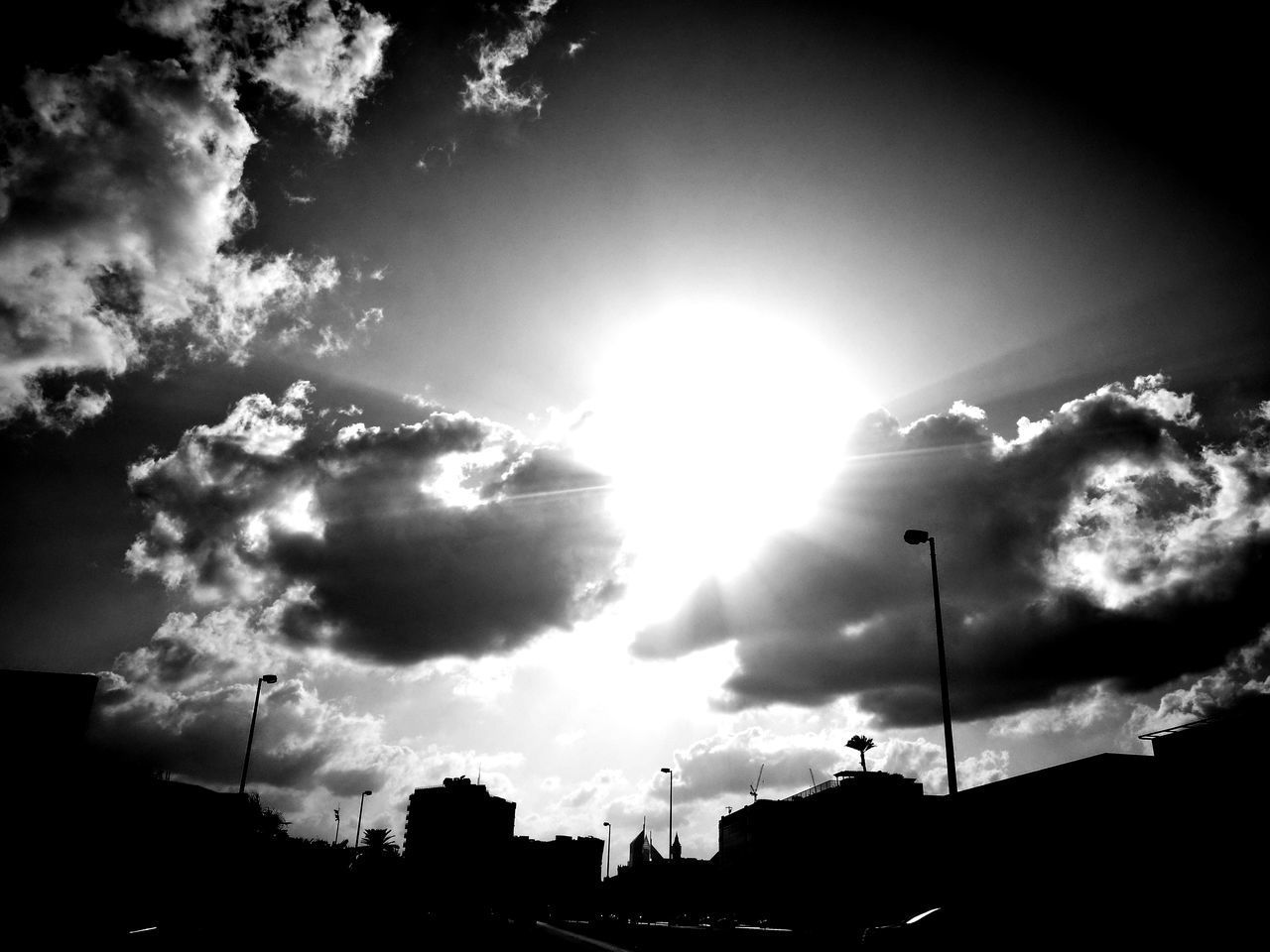 LOW ANGLE VIEW OF SILHOUETTE BUILT STRUCTURES AGAINST SKY