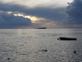 Scenic view of sea against dramatic sky