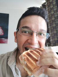 Portrait of young man with ice cream