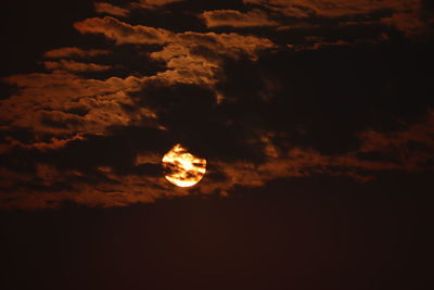 Low angle view of moon against sky at sunset