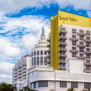 Low angle view of buildings against cloudy sky