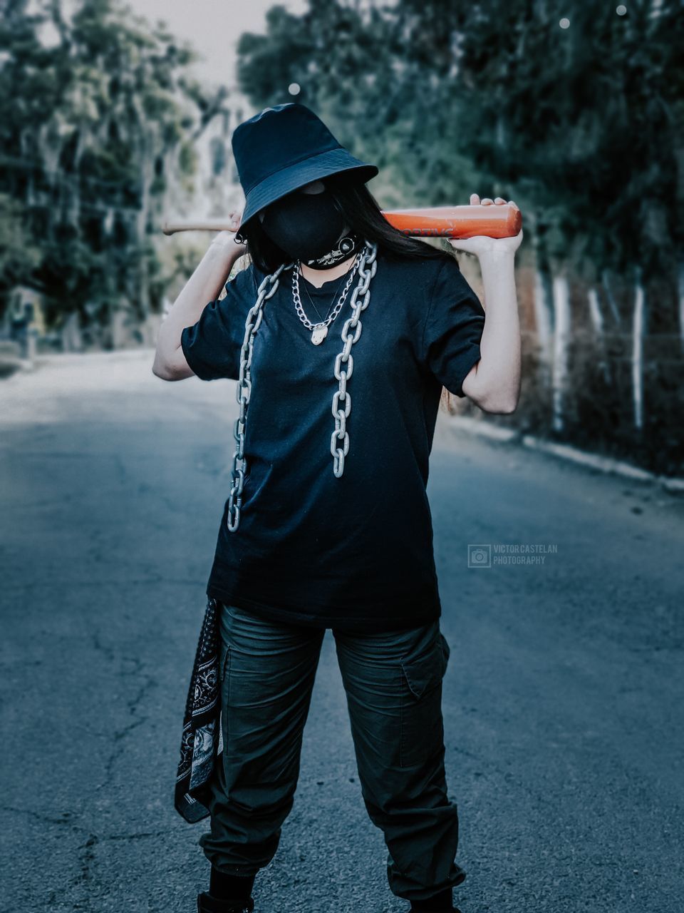 FULL LENGTH OF WOMAN STANDING ON ROAD