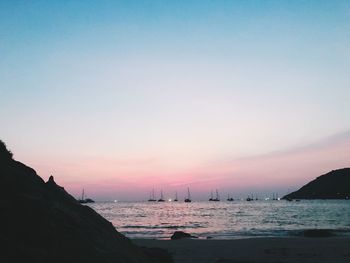 Scenic view of sea against clear sky during sunset