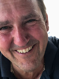 Close-up portrait of a smiling young man