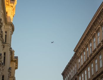 Low angle view of airplane flying in sky