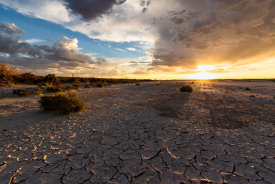 Scenic view of landscape against sky during sunset