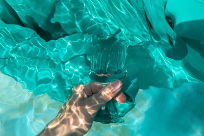 High angle view of woman swimming in sea