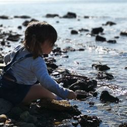 Girl sitting at beach