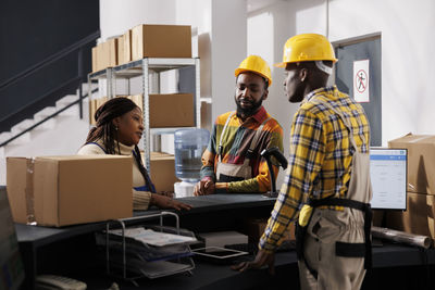 Rear view of man working in office