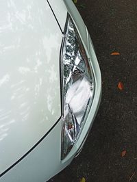 High angle view of ferris wheel on side-view mirror