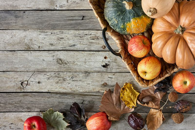 High angle view of fruits and leaves on table