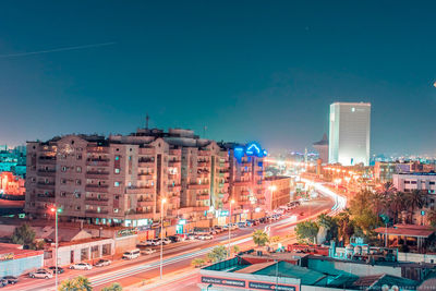 Buildings in city against blue sky