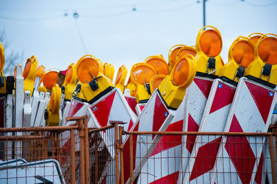 Low angle view of multi colored umbrellas against sky