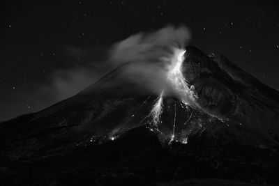 Scenic view of landscape against sky at night