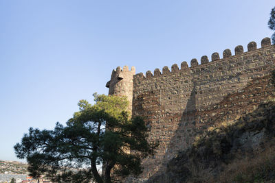 Low angle view of fort against the sky