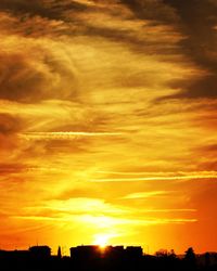 Scenic view of dramatic sky during sunset