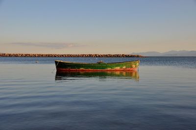 Boat in lake against clear sky