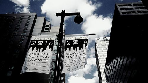 Low angle view of building against cloudy sky