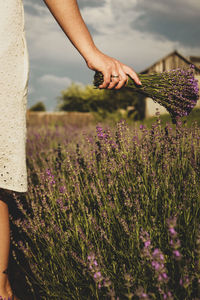 Low angle view of woman standing on field