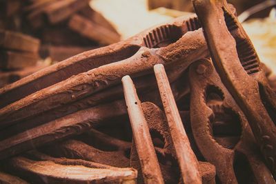 Close-up of rusty stack on wood
