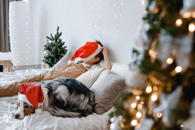 Portrait of woman with dog at home