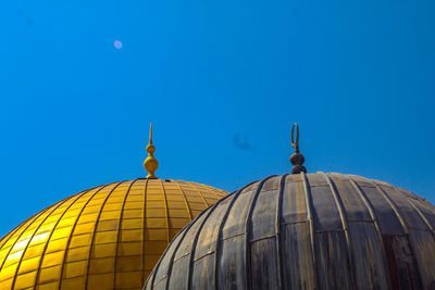 Low angle view of a building against blue sky