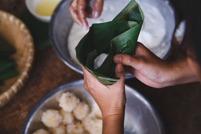 Midsection of woman holding food