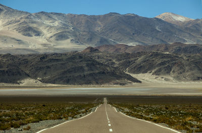 Country road leading towards mountains