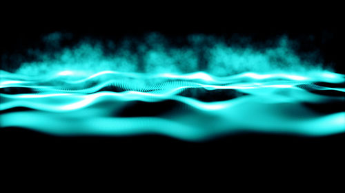 Close-up of illuminated water at night